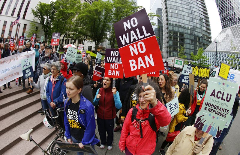 Trump travel ban partly reinstated; fall court arguments set